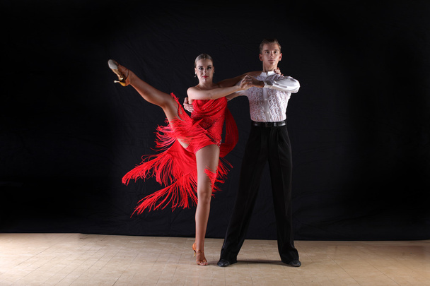 dancers in ballroom against black background - Фото, изображение