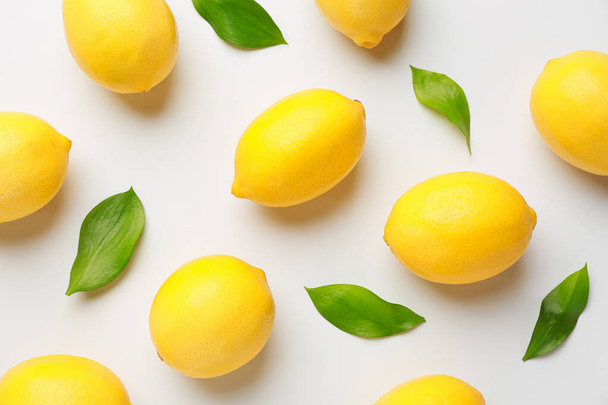 Ripe lemons on white background - Fotó, kép