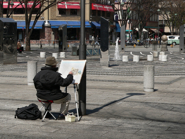Escena callejera con pintor
 - Foto, imagen