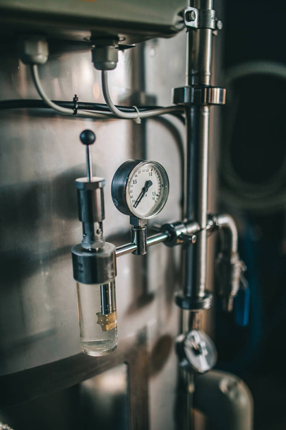 Craft beer brewing equipment in brewery! Metal tanks, alcoholic drink production - 写真・画像