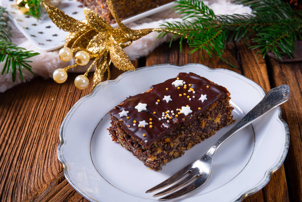 Christmas poppy cake with chocolate. - Photo, Image