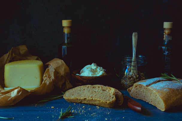 cheeses and bread on a rustic background - Photo, Image