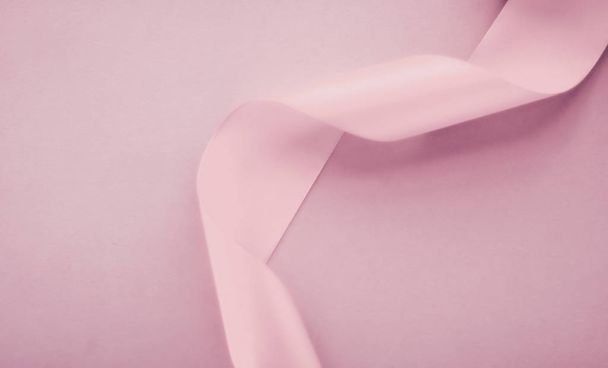 Abstract silk ribbon on blush pink background, exclusive luxury  - Foto, Imagen
