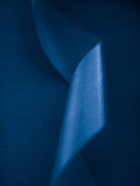 Abstract silk ribbon on royal blue background, exclusive luxury  - Foto, imagen