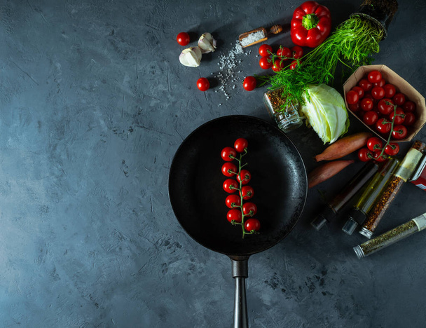fresh vegetables and frying pan on dark background - Photo, Image