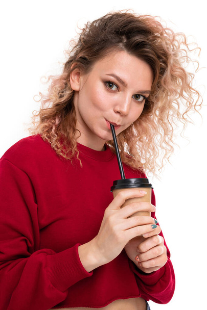 young beautiful blonde woman posing with coffee against white background - Photo, Image