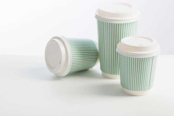 paper cup of coffee on white background  - 写真・画像
