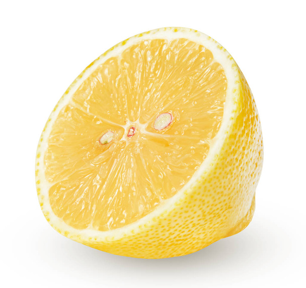 Half a lemon isolated on a white background. The correct round shape and good texture. Clipping path. - Foto, afbeelding