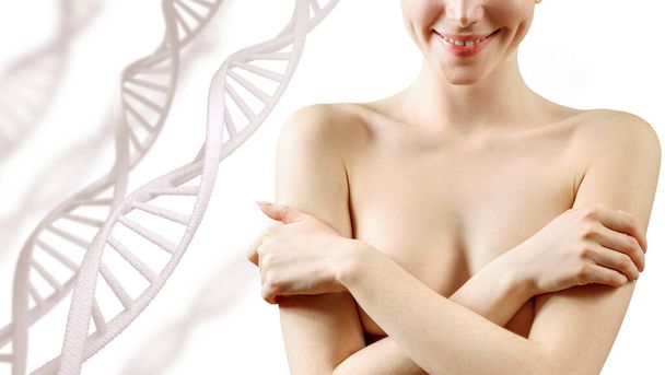 Mujer joven cubriendo el pecho con las manos entre los tallos de ADN. - Foto, imagen