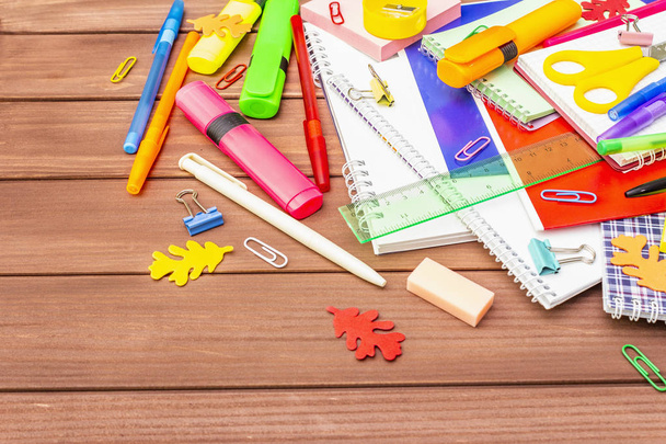 Back to school concept. School education supplies on brown wooden boards background - Photo, Image