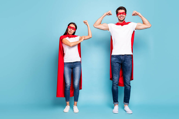 Full length body size view of nice competitive cheery sporty people in red hero look showing arm muscle weak female gender vs masculine isolated on bright vivid shine vibrant blue turquoise background - Φωτογραφία, εικόνα