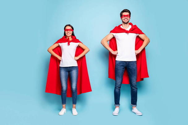 Full length body size view of his he her she nice attractive content cheerful sporty people wearing red superhero look hands on hips isolated on bright vivid shine vibrant blue turquoise background - Фото, изображение