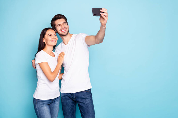 Portrait of his he her she nice-looking attractive charming lovely cheerful cheery couple hugging taking making selfie isolated on bright vivid shine vibrant blue turquoise background - Zdjęcie, obraz