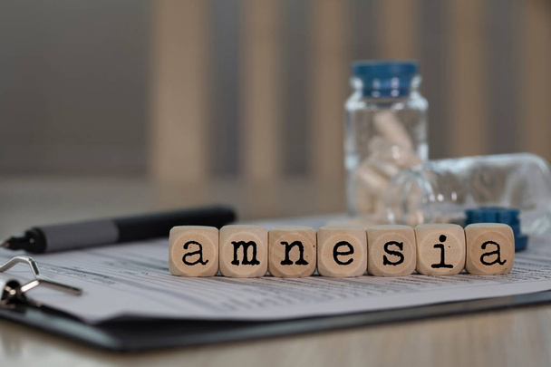 Word AMNESIA composed of wooden dices.  - Photo, Image