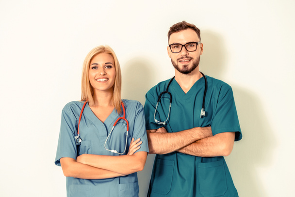 Portrait of confident doctors with arms crossed. - Foto, afbeelding