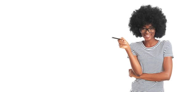 Happy afro woman with a pen isolated on white background. - Photo, Image