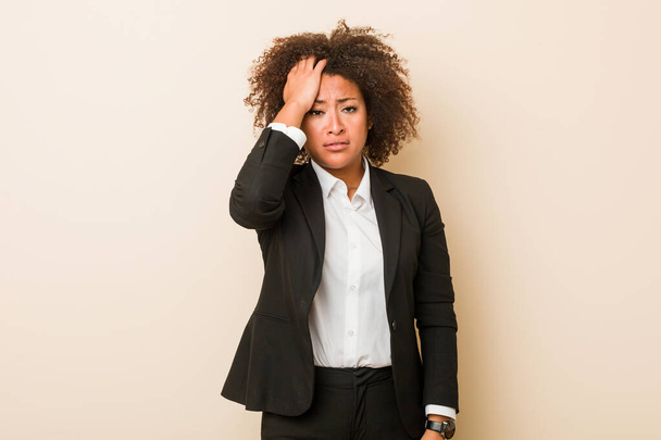 Young business african american woman tired and very sleepy keeping hand on head. - Foto, Imagen