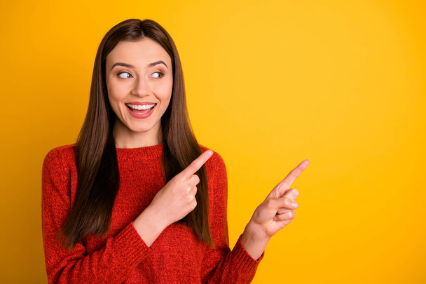 Photo of white cheerful cute nice charming gorgeous millennial pointing at empty space expressing pleasure with face isolated over vivid color background - Fotografie, Obrázek