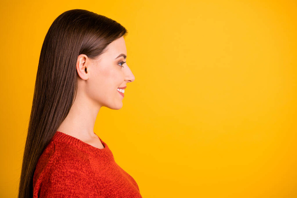 Photo of beautiful cute charming nice girlfriend looking into empty space created for new information isolated over yellow vivid color background - Fotoğraf, Görsel