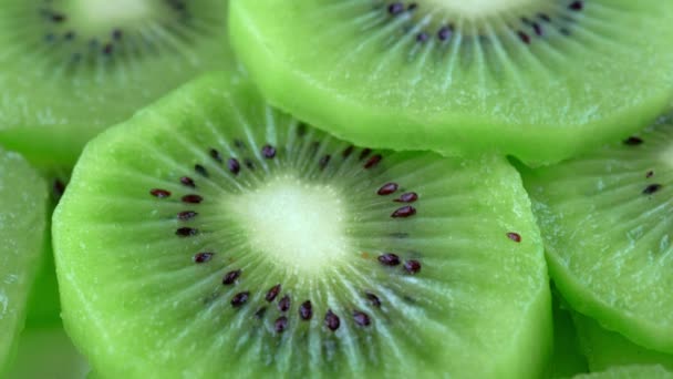 macro rotation video shooting of slice kiwi fruit .Close up flesh of kiwi. - Footage, Video