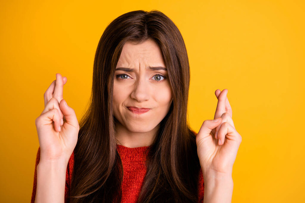 Close up photo of cute sweet nice frightened girl with fingers crossed with terrified facial expression isolated over vibrant color background - Fotoğraf, Görsel