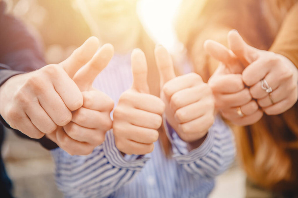 Thumbs up teenagers approve and show gesture like, sunlight - Zdjęcie, obraz