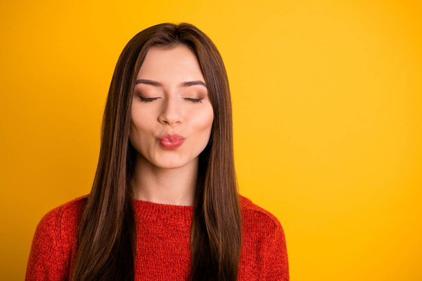 Close up photo of calm peaceful positive girl close her eyes imagine she has date with luxurious guy send air kisses wear good look outfit isolated over yellow color background - Foto, immagini