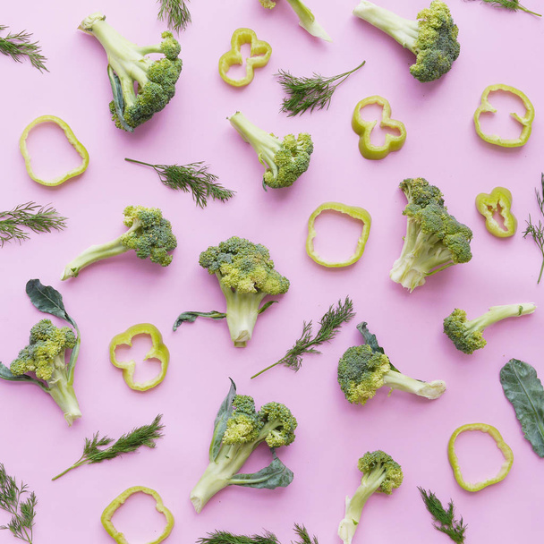 creative flat layout of vegetables top view, broccoli on a pink background - Photo, Image