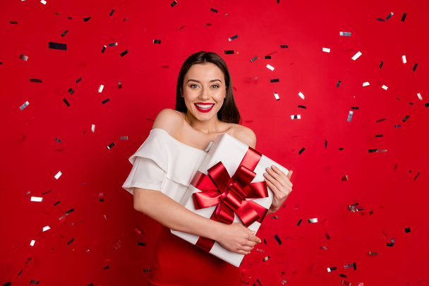 Portrait of her she nice-looking attractive lovely smart fascinating cheerful cheery glad lady holding in hands embracing enjoying romantic box isolated on bright vivid shine red background - Φωτογραφία, εικόνα