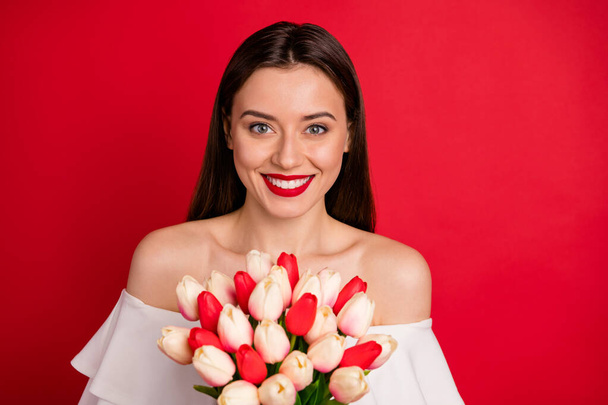 Close up photo of sweet lady holding fresh gift for 14-march isolated over red background - Foto, immagini