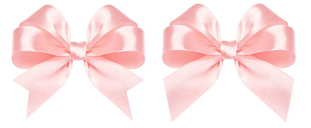 Arco de regalo hecho de cinta de seda rosa aislada sobre fondo blanco
 - Foto, Imagen