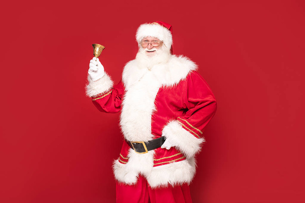 Real Santa Claus on red studio background. - Photo, Image