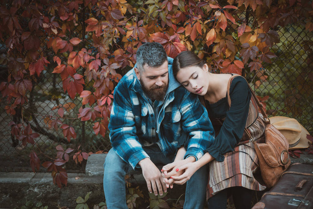 Attractive couple having a romantic moment together, dressing in traditional rural style sitting close to each other on an autumn day. The concept of genuine emotions. Meeting and accompany your - Φωτογραφία, εικόνα