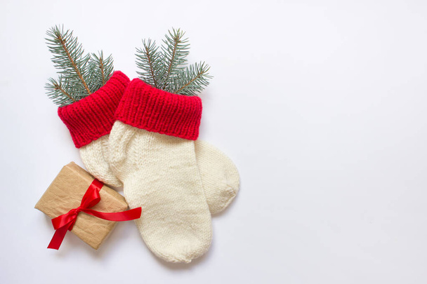 Christmas socks with a present tied with red bow - Fotografie, Obrázek