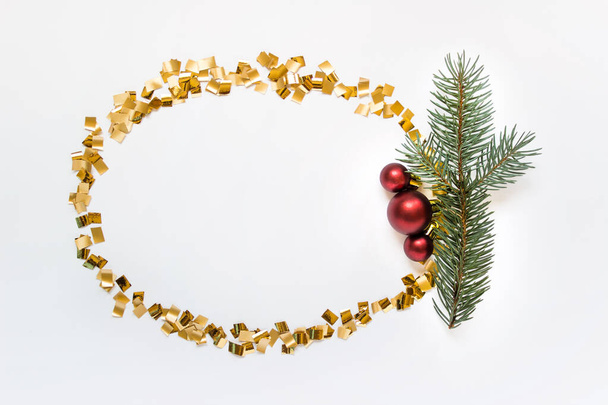 Golden wreath with ball and fir branch - Фото, зображення