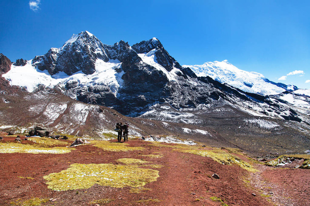 Ausangate trek trekking trail with two tourists - Foto, Imagem