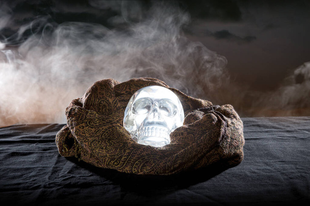 Scary or creepy glowing crystal skull on Halloween holiday or Dia De Los Muertos Day of the Dead festival.  Depicts horror theme and superstition.  - Φωτογραφία, εικόνα