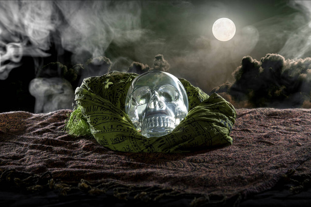 Scary or creepy glowing crystal skull on Halloween holiday or Dia De Los Muertos Day of the Dead festival.  Depicts horror theme and superstition.  - Fotoğraf, Görsel