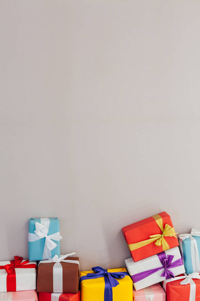 lots of colorful birthday gifts on a gray background - Photo, Image