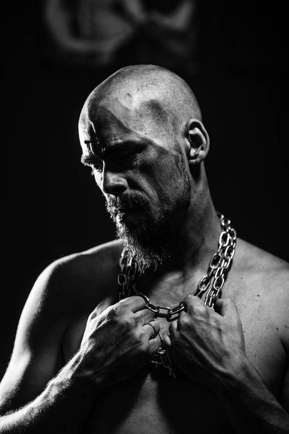 black and white portrait of a sad man tearing the chain  - Fotó, kép