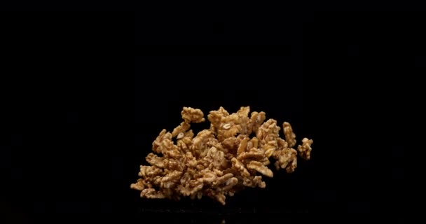 walnuts falling on dark background  - Metraje, vídeo