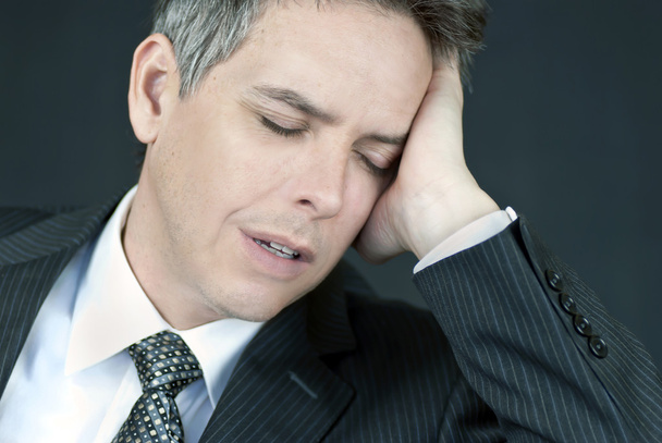 Defeated Businessman Holds Head In Hand - Photo, Image