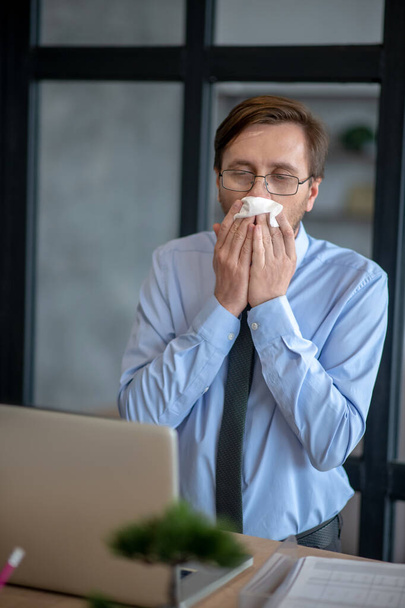 Dark-haired sick office worker sneezing all day - Φωτογραφία, εικόνα
