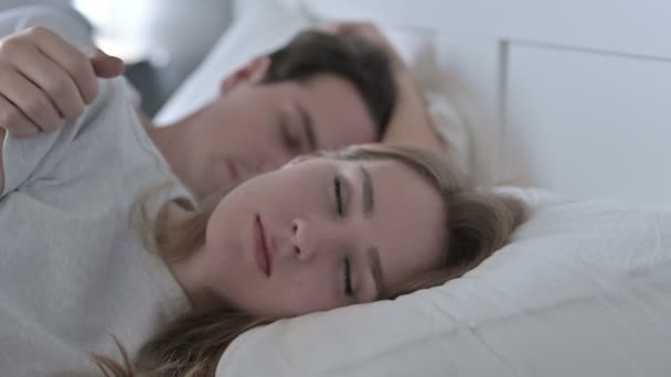 Attractive Couple Sleeping in Bed Peacefully - Materiał filmowy, wideo