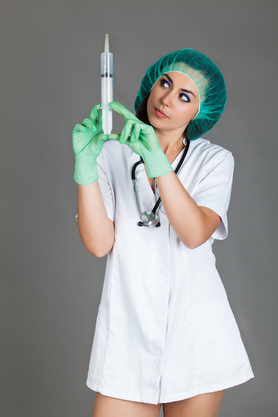 woman doctor on grey background - Fotografie, Obrázek