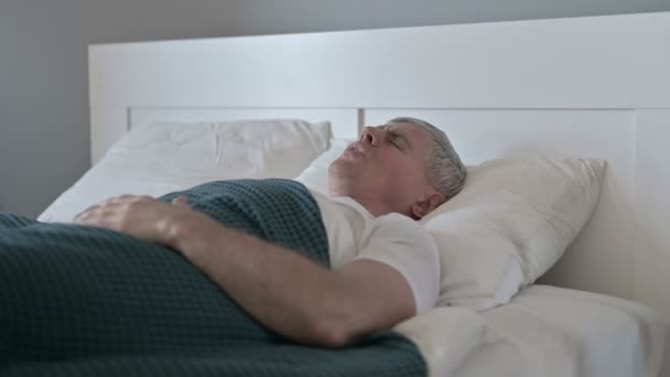 Sick Middle Aged Man having Back Pain while Sleeping in Bed - Video, Çekim