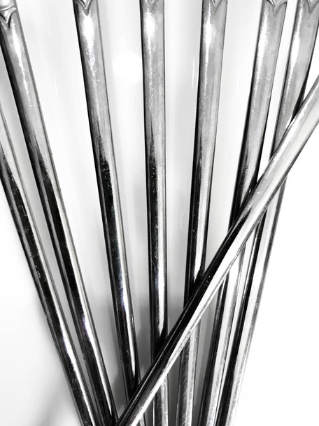 Stainless steel chopsticks isolated on white background, abstract lines background design from Stainless steel chopsticks - Photo, Image