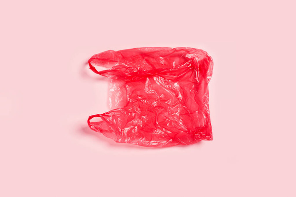 One plastic bag on pink background. - Fotoğraf, Görsel