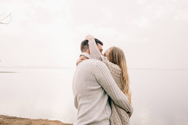 couple hugging on a pier - Photo, image