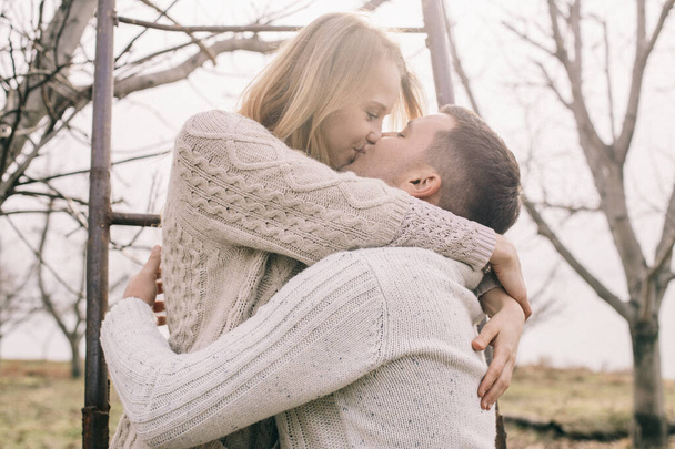 couple hugging and kiss on a pier - Фото, зображення